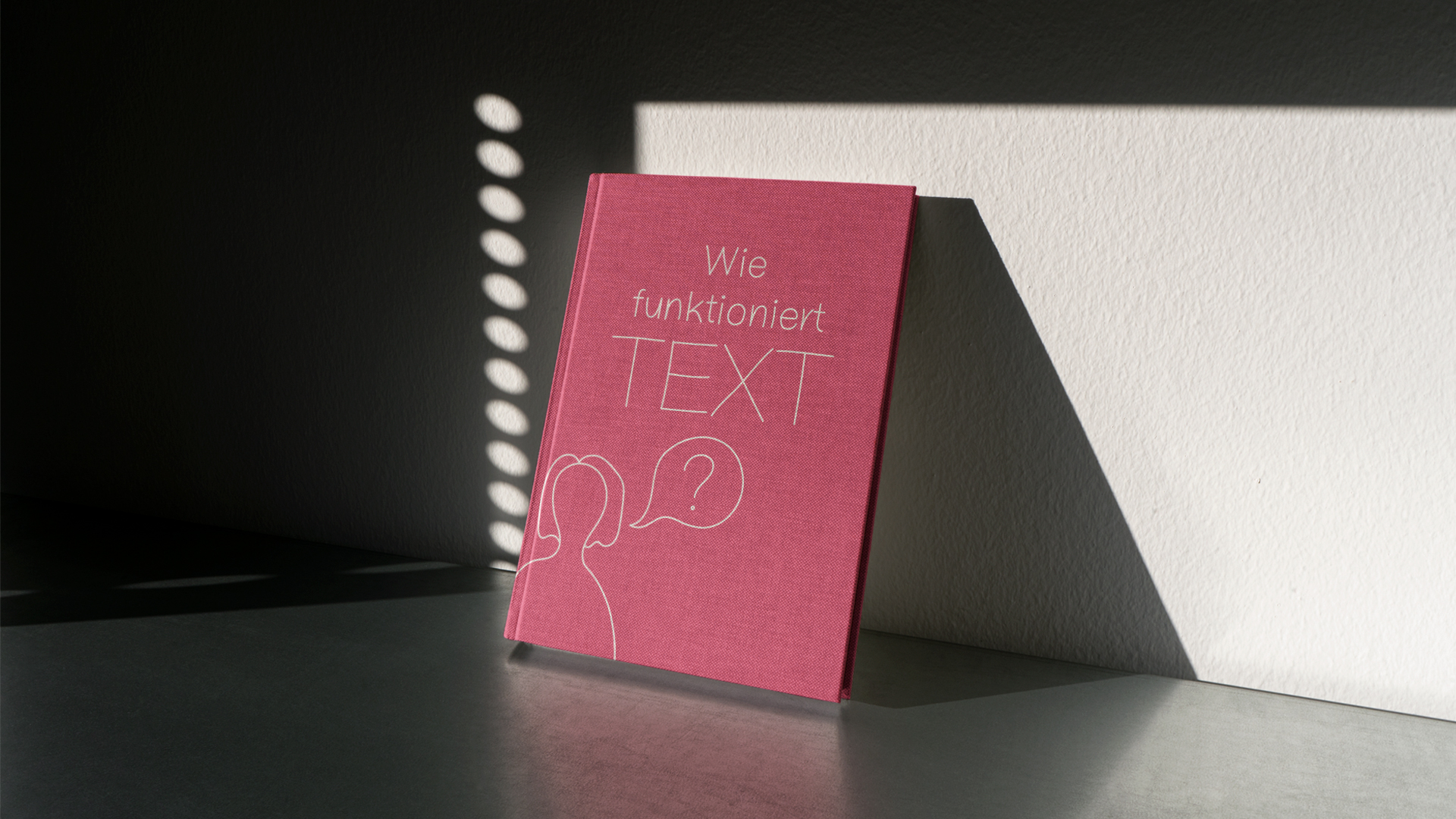 Text Magazine is laying against a wall